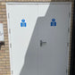 White fire rated door with blue signs on a brick wall