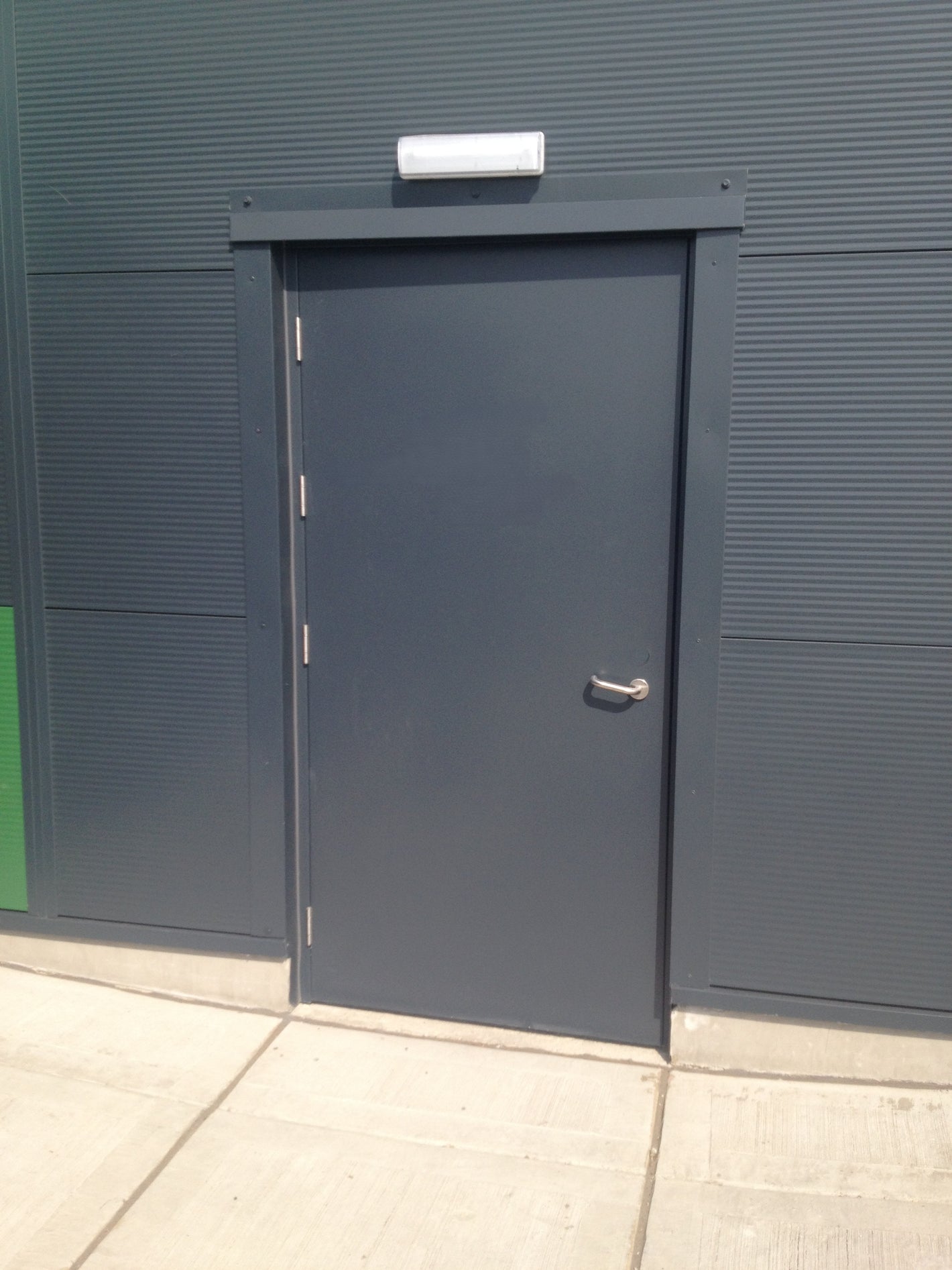 Metallic Fire Rated door on a building facade 