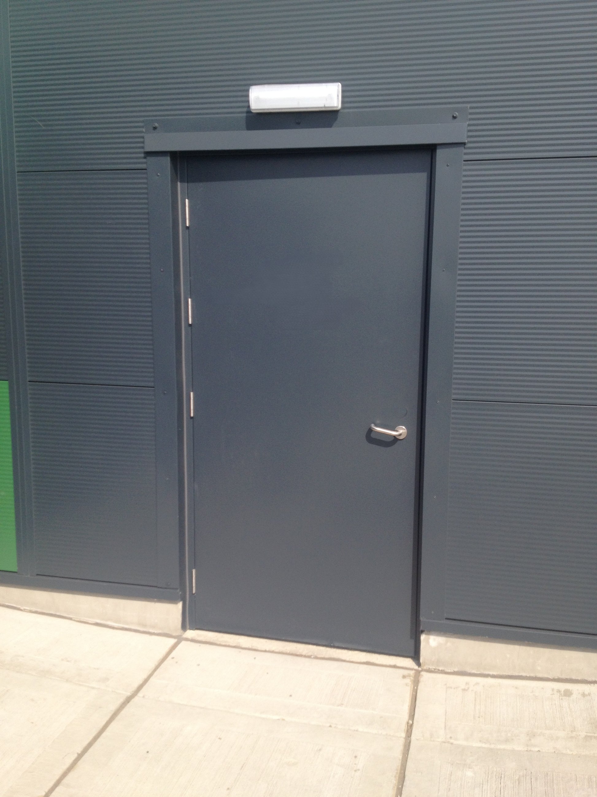 Metallic Fire Rated door on a building facade 